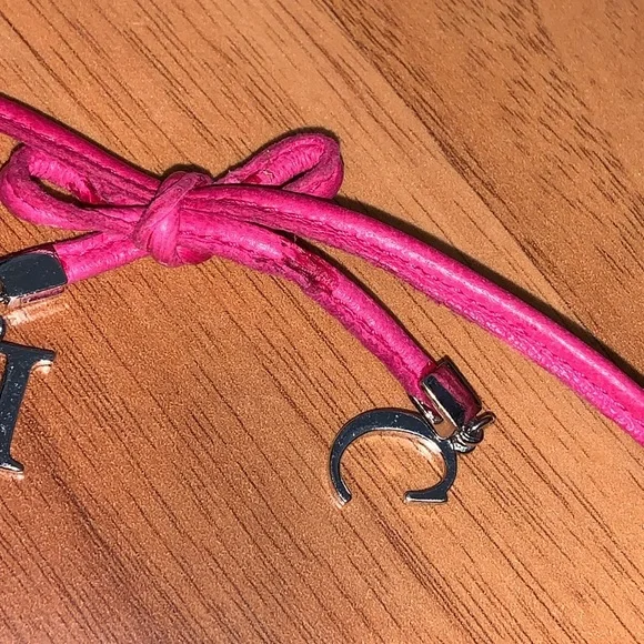 Authentic Christian Dior Leather and Metal Charm Bow Bracelet - Picture 8 of 11